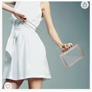 Clear clutch with gold chain strap